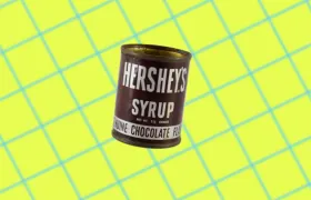 Vintage Hershey’s Syrup tin can with white lettering on brown label
