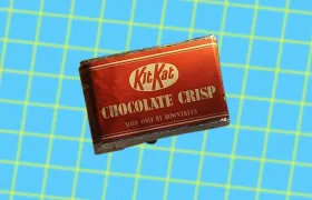 Vintage Rowntree's Kit Kat Chocolate Crisp wrapper on blue grid