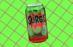 Dented green Surge soda can with red splash logo on green diamond grid
