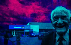 Smiling elderly man in a suit beside a Walmart storefront