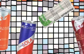 Four Red Bull energy drink cans on colorful mosaic background
