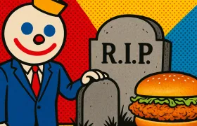 Jack in the Box mascot beside R.I.P. gravestone and chicken sandwich