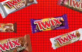 Six discontinued Twix bar wrappers on a red grid background